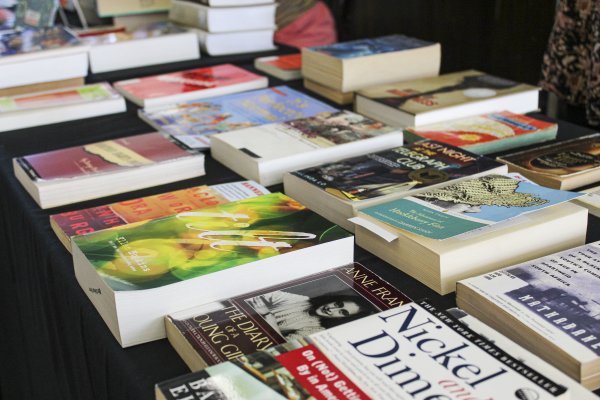 Series of books banned throughout the decades displayed on a table.